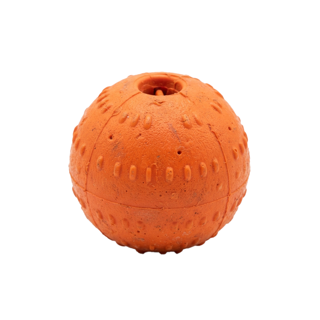 Bright orange rubber ball with a central hole and a textured surface