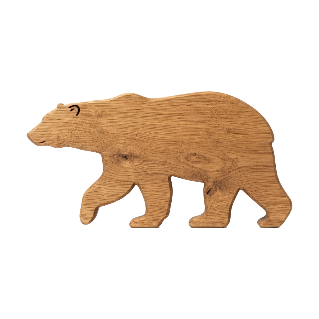 A detailed wooden carving of a polar bear standing on all fours against a black background