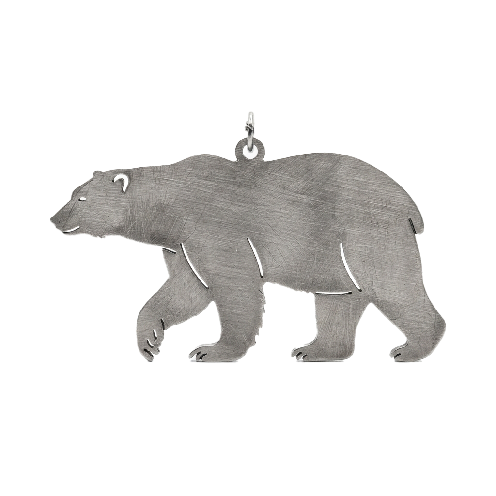 A silver metal pendant featuring a stylized polar bear silhouette with a loop at the top for hanging