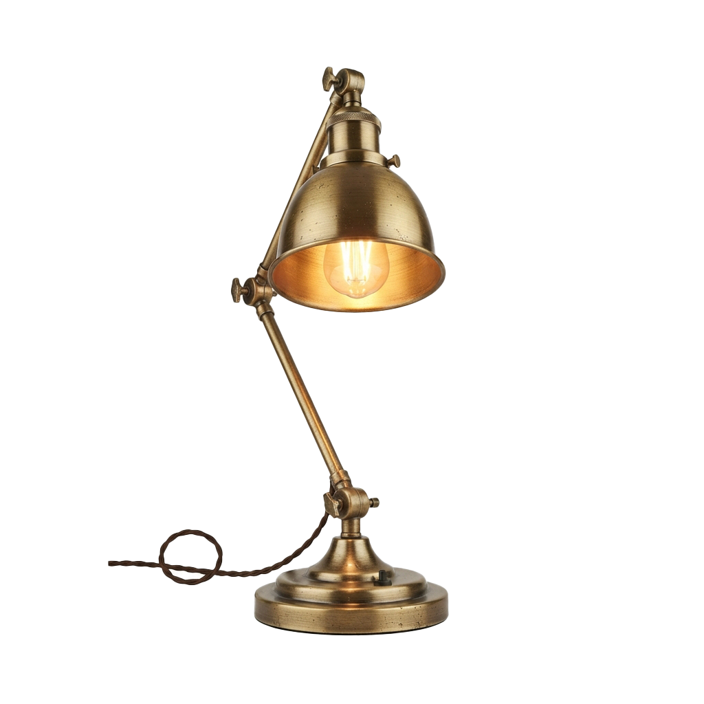 A brass-colored adjustable desk lamp with a round shade and flexible arm on a round base