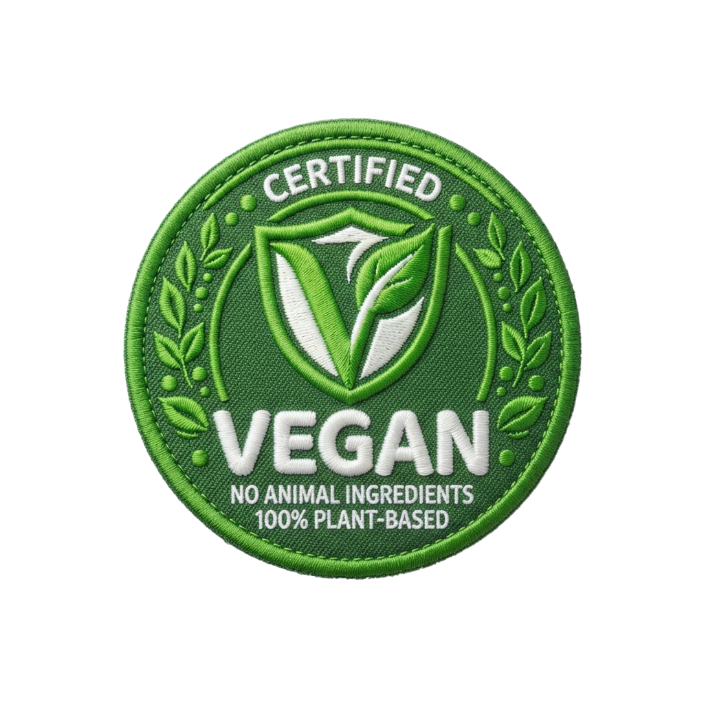 Green circular badge labeled Vegan with a leaf emblem and text stating no animal ingredients and 100 percent plant-based