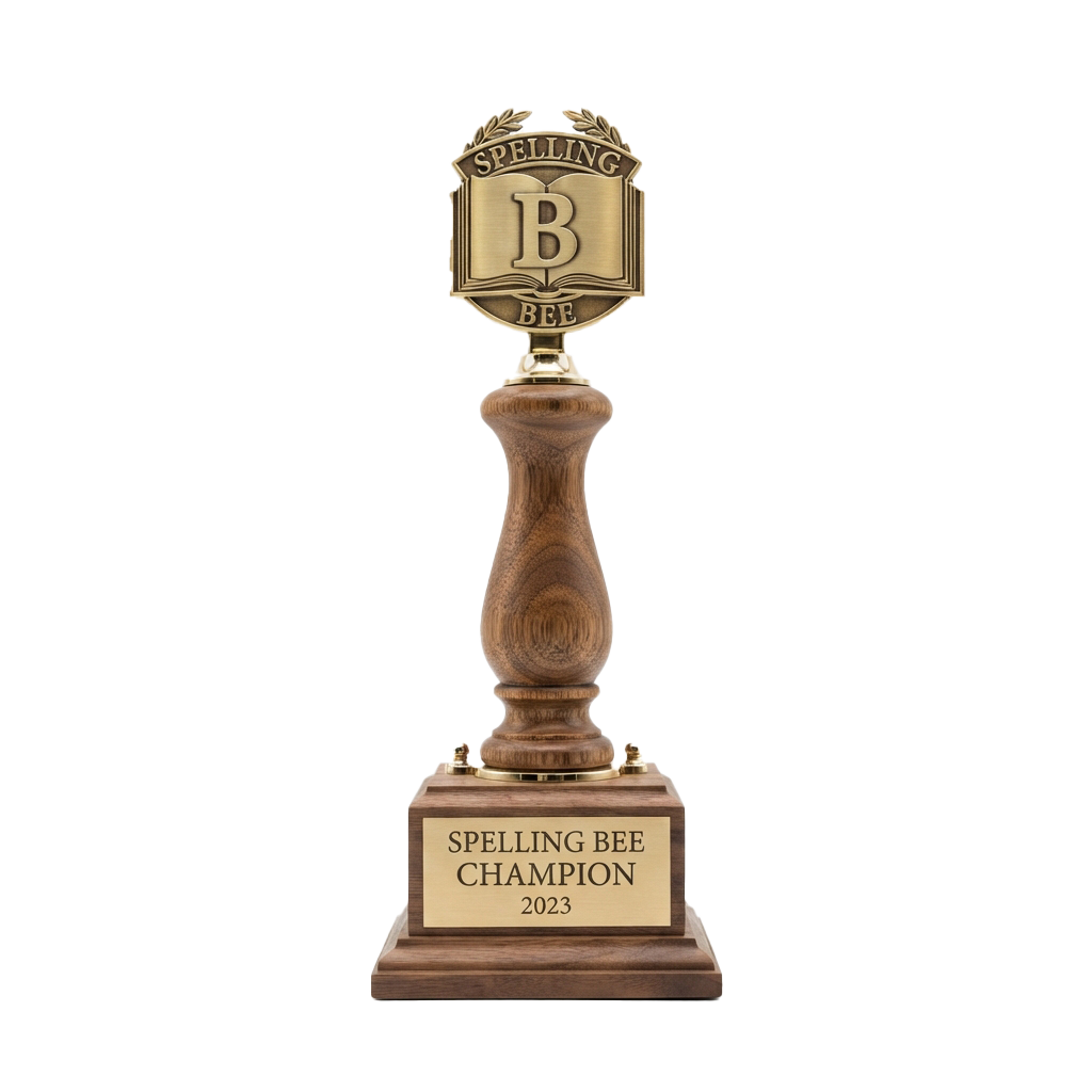 Award trophy for Spelling Bee Champion 2023 with a wooden base and gold emblem featuring a large letter B and laurel leaves