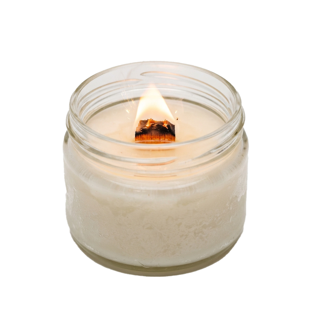 A lit white candle inside a transparent glass jar with a lid, emitting a soft glow