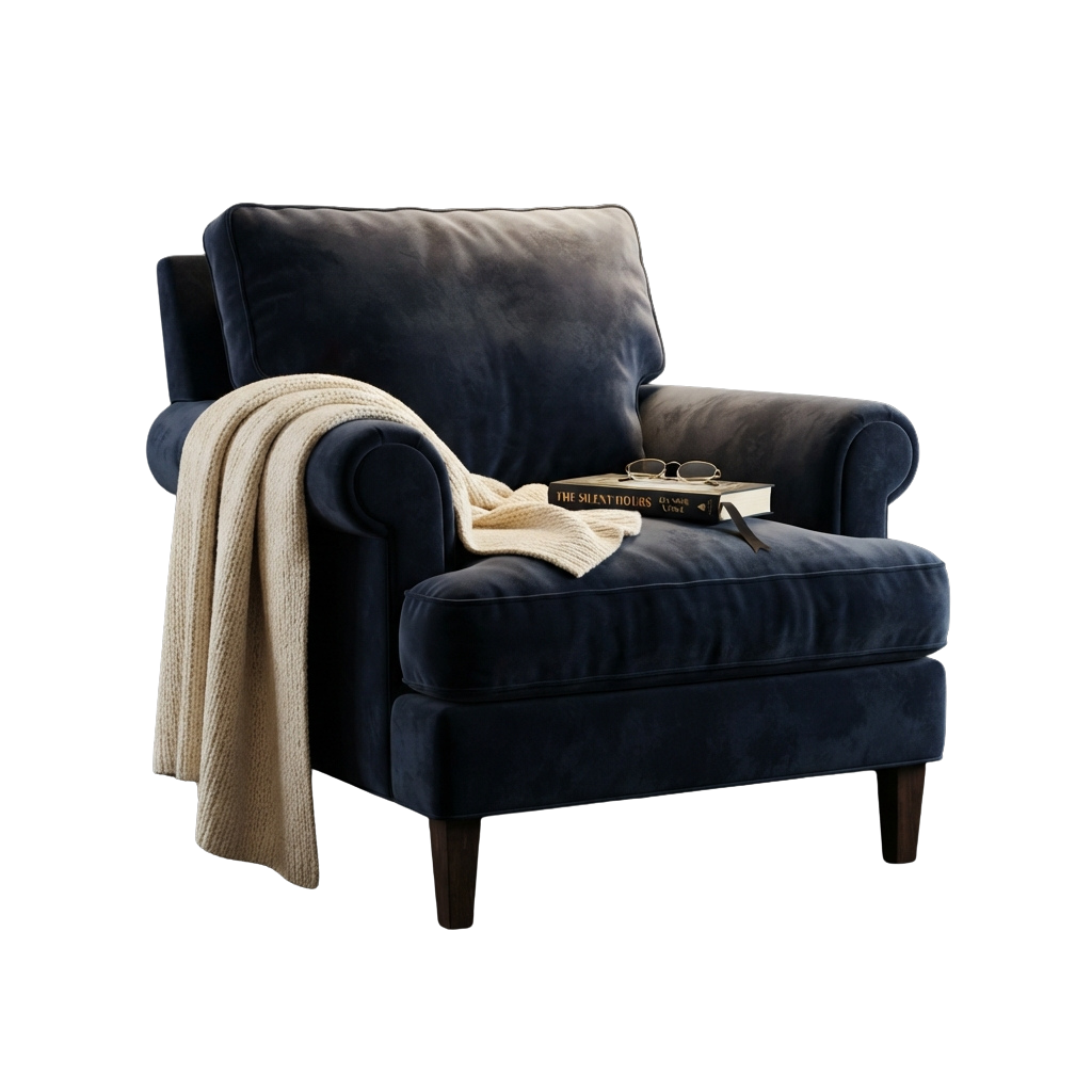 A dark blue armchair with a cream knit throw draped over the back and arm, a book, and a pair of glasses on the seat