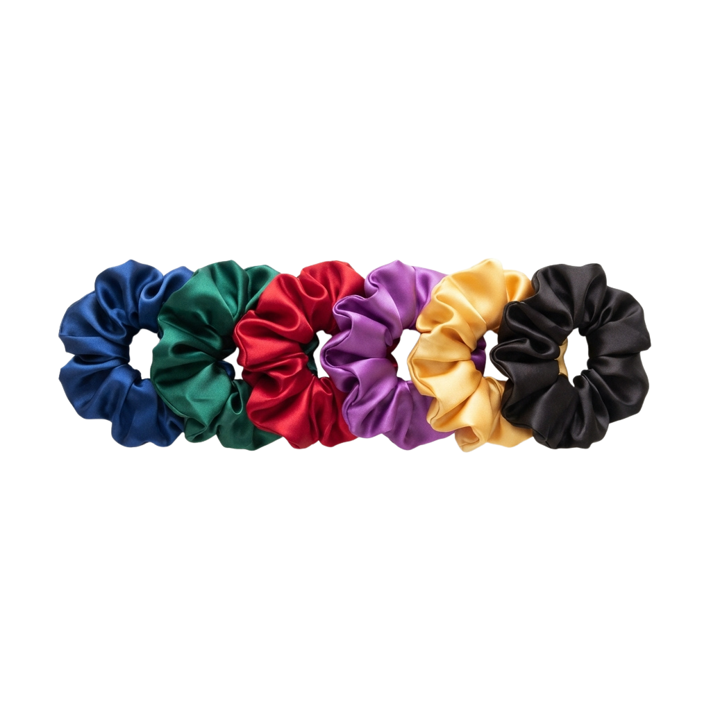 Six fabric scrunchies in blue, green, red, purple, yellow, and black arranged in a row