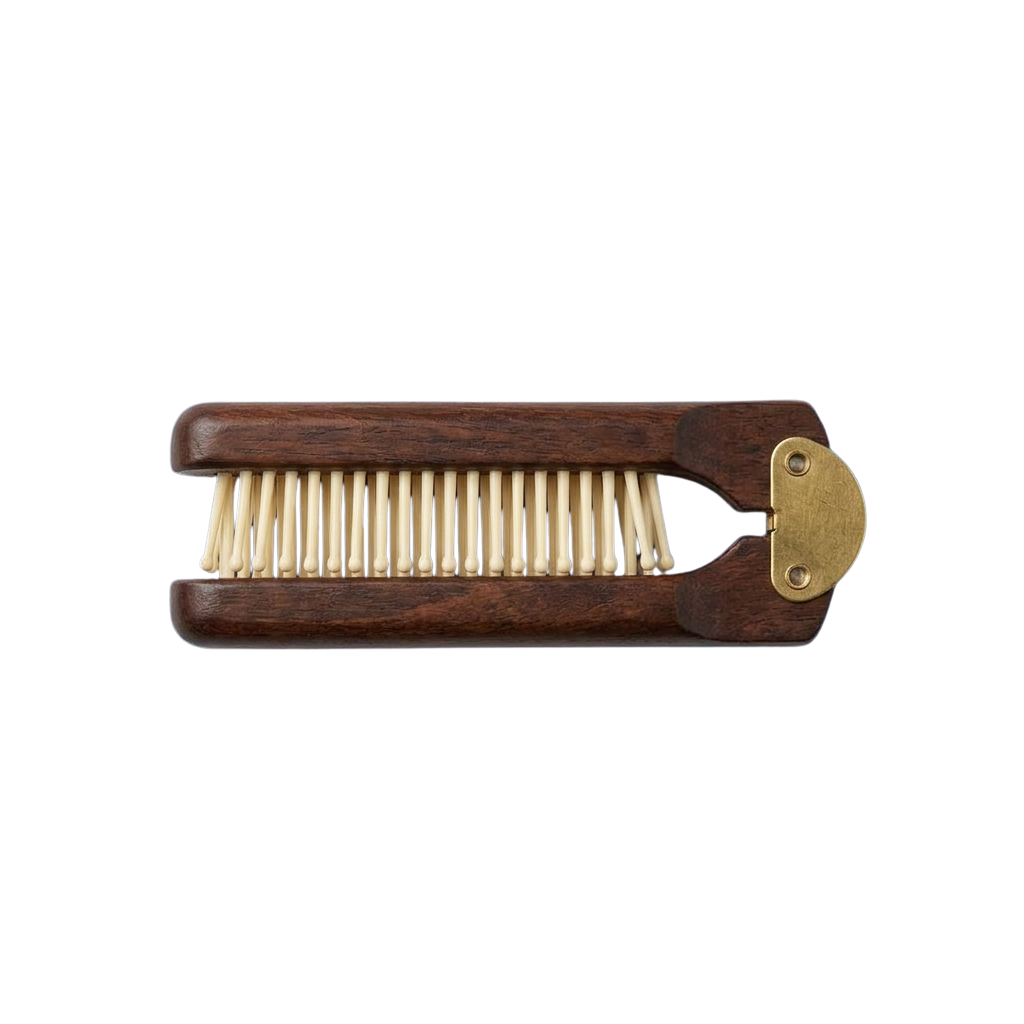 A wooden comb with brass clasp and evenly spaced teeth for detangling hair